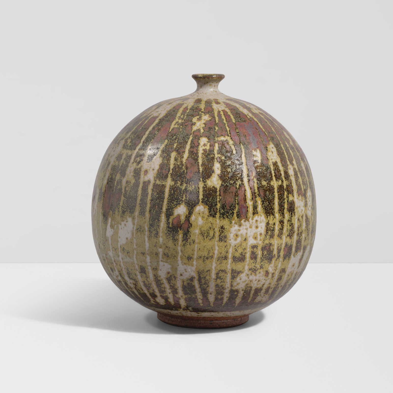 PETER VOULKOS (1924-2002) Lined Spherical Vessel1950sglazed stoneware, incised 'Voulkos' on und...: PETER VOULKOS (1924-2002) Lined Spherical Vessel 1950s glazed stoneware, incised 'Voulkos' on underside height 8in (20.4cm); diameter 7 1/2in (9cm) Saleroom notices: Exhibited: New York, America House