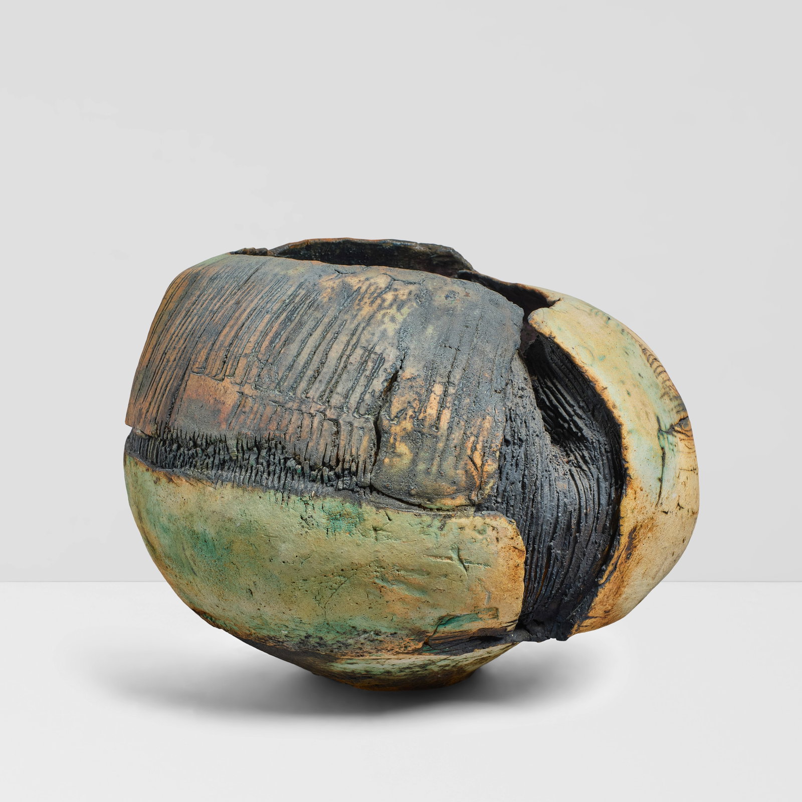 RUTH DUCKWORTH (1919-2009) Open 'Mama Pot'circa 1970incised, hand-worked, and partially glazed s...: RUTH DUCKWORTH (1919-2009) Open 'Mama Pot' circa 1970 incised, hand-worked, and partially glazed stoneware, initialed 'R' on underside height 13 3/4in (34.9cm); widest width 18 1/2in (47cm) Footnotes: