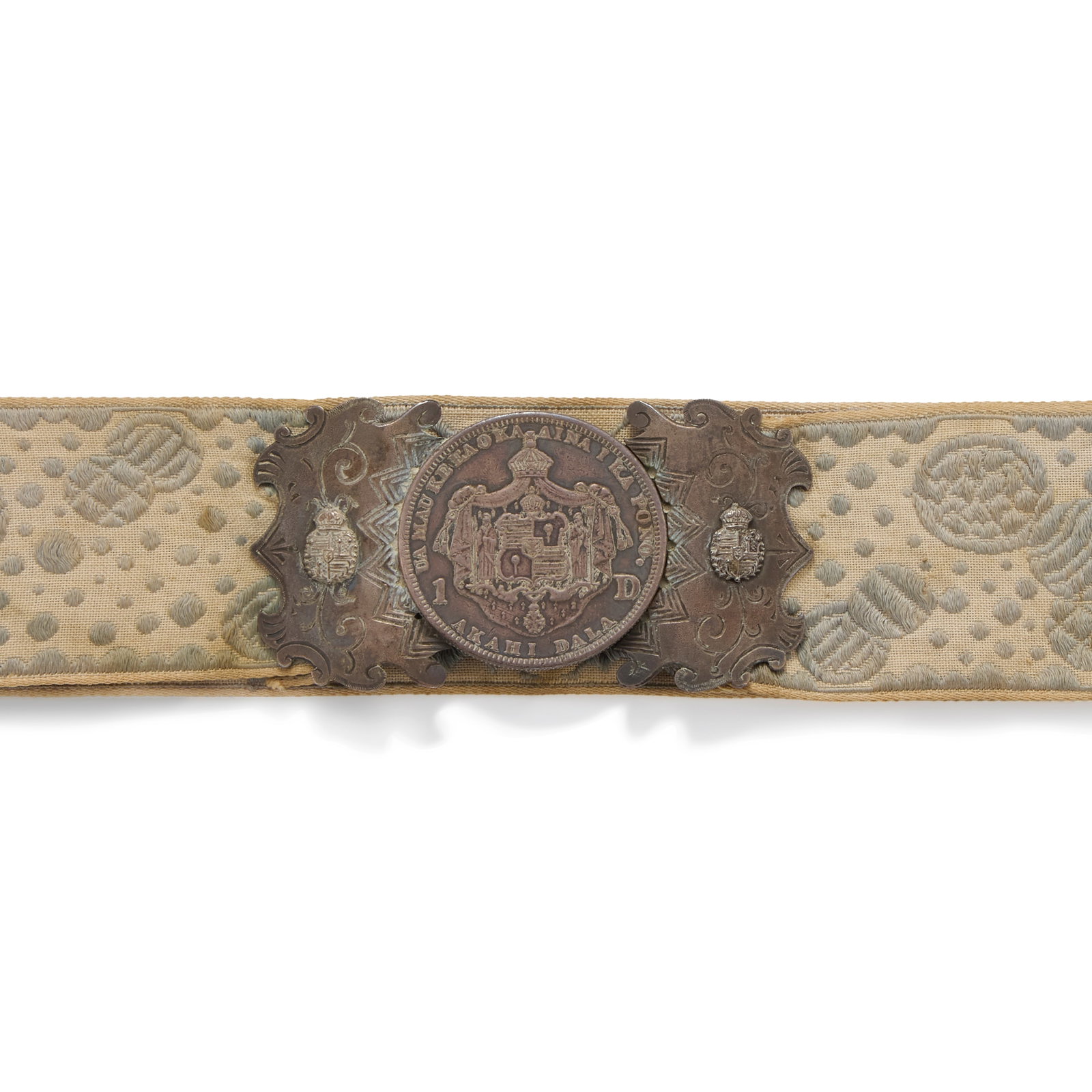 Belt, Likely Made for Princess Kaʻiulani (1875-1899): Belt, Likely Made for Princess Kaʻiulani (1875-1899) Brocade trim with 1883 King Kalākaua I akahi dala (dollar) hook and loop buckle silver and woven silk fabric 24 in. (61 cm) fabric length