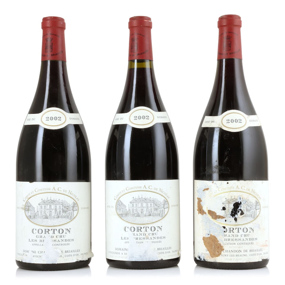 Domaine Chandon de Briailles, Corton Les Bressandes, 2002 (3 x 1500ml): Domaine Chandon de Briailles, Corton Les Bressandes, 2002 (3 x 1500ml) Region: Côte de Beaune Capsule: lightly corroded & nicked Label: damp-affected, torn, peeling & incomplete, 1 with cardboard
