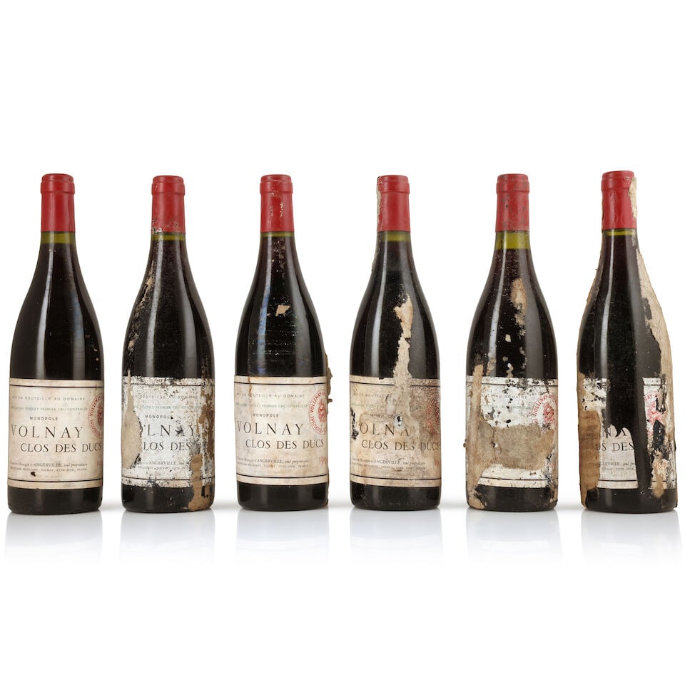 Domaine Marquis d'Angerville, Volnay 1er Cru Clos des Ducs, 1990 (6 x 750ml): Domaine Marquis d'Angerville, Volnay 1er Cru Clos des Ducs, 1990 (6 x 750ml) Region: Côte de Beaune Capsule: bin-soiled & worn capsules Label: badly bin-soiled, damp-stained & scuffed with remain