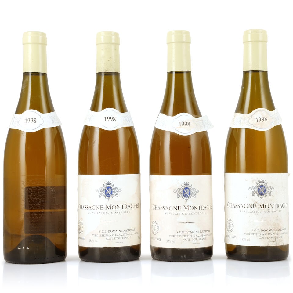Domaine Ramonet, Chassagne-Montrachet, 1998 (4 x 750ml): Domaine Ramonet, Chassagne-Montrachet, 1998 (4 x 750ml) Region: Côte de Beaune Capsule: 1 corroded Label: badly bin-soiled, damp-stained, creased & peeling, two nicked, 1 lacking; part detached n