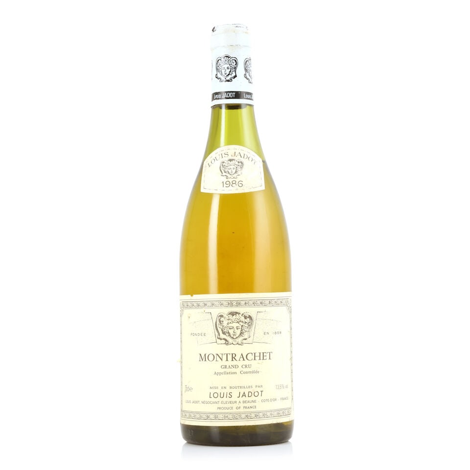 Louis Jadot, Montrachet, 1986 (1 x 750ml): Louis Jadot, Montrachet, 1986 (1 x 750ml) Region: Côte de Beaune Fill Level: 4cms Capsule: corroded & nicked Label: bin-soiled, creased & nicked For further information on this lot please visit B