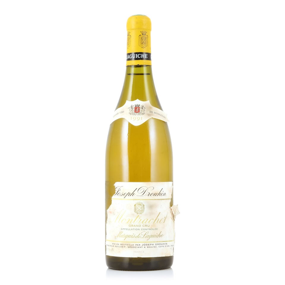 Joseph Drouhin, Montrachet Marquis de Laguiche, 1991 (1 x 750ml): Joseph Drouhin, Montrachet Marquis de Laguiche, 1991 (1 x 750ml) Region: Côte de Beaune Capsule: lightly corroded & expanded Label: badly bin-soiled, damp-stained, torn, peeling & incomplete For 