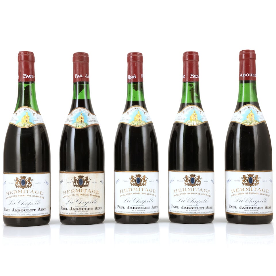 Domaine Paul Jaboulet Aîné, Hermitage La Chapelle, 1982 (5 x 750ml): Domaine Paul Jaboulet Aîné, Hermitage La Chapelle, 1982 (5 x 750ml) Region: Rhône Valley Fill Level: 1 x 3cm, 2 x 3.5cm, 1 x 4cm, 1 x 5cm Capsule: slightly corroded, 1 nicked Label: bin