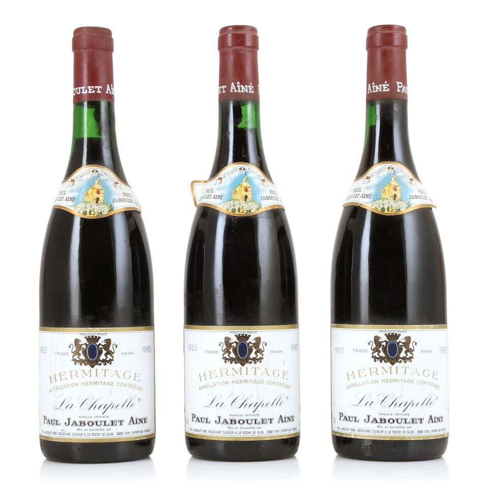 Domaine Paul Jaboulet Aîné, Hermitage La Chapelle, 1983 (3 x 750ml): Domaine Paul Jaboulet Aîné, Hermitage La Chapelle, 1983 (3 x 750ml) Region: Rhône Valley Capsule: lightly corroded with signs of old seepage Label: bin-soiled, damp-affected & peeling F