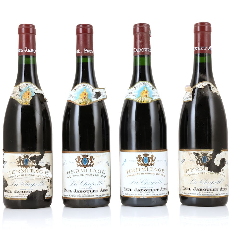 Domaine Paul Jaboulet Aîné, Hermitage La Chapelle, 1989 (4 x 750ml): Domaine Paul Jaboulet Aîné, Hermitage La Chapelle, 1989 (4 x 750ml) Region: Rhône Valley Capsule: 1 slightly corroded & nicked, 1 with congé Label: badly bin-soiled & damp-stained,