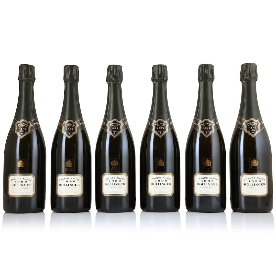 Bollinger, La Grande Année, 1990 (6 x 750ml): Bollinger, La Grande Année, 1990 (6 x 750ml) Region: Champagne Label: lightly damp-affected - 3 stained Packaging: individual presentation cases in original carton (lightly damp-affected) For