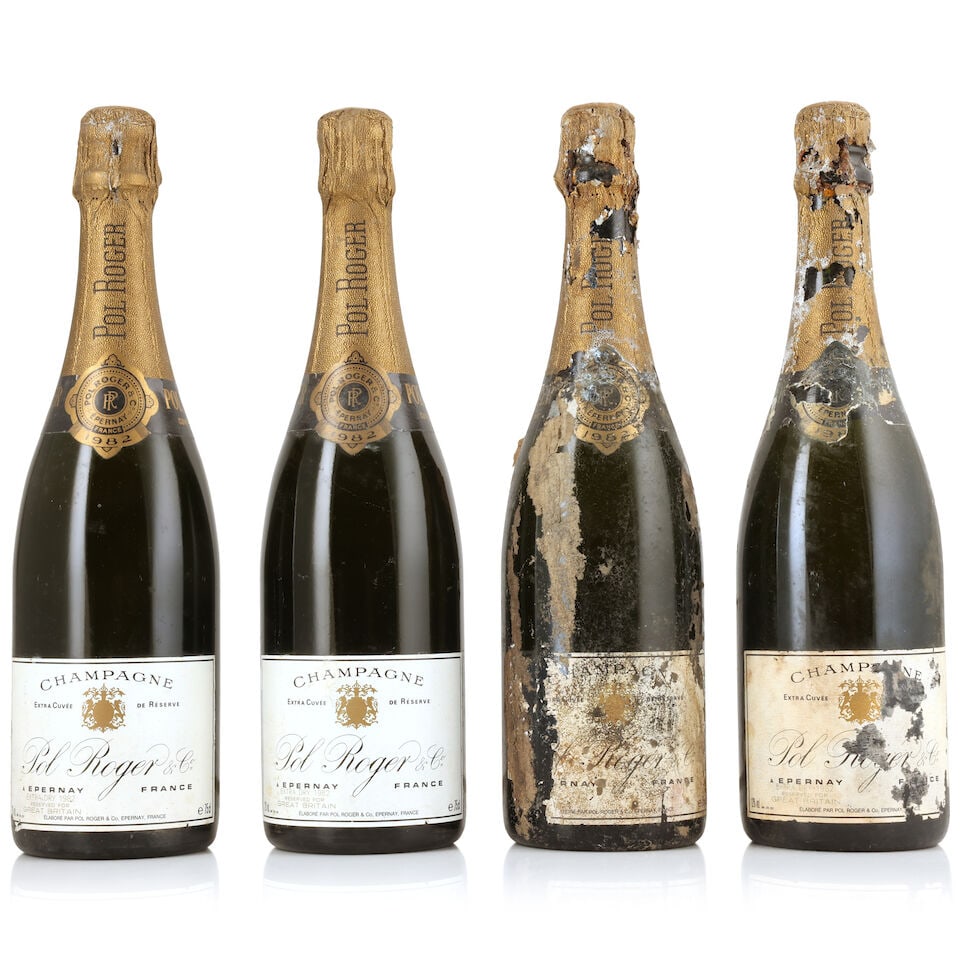 Pol Roger, Extra Cuvée de Réserve, 1982 (4 x 750ml): Pol Roger, Extra Cuvée de Réserve, 1982 (4 x 750ml) Region: Champagne Capsule: corroded foils - 2 lightly, 2 badly Label: damp-affected, bin-soiled & nicked - 2 badly, stained, torn & incomp