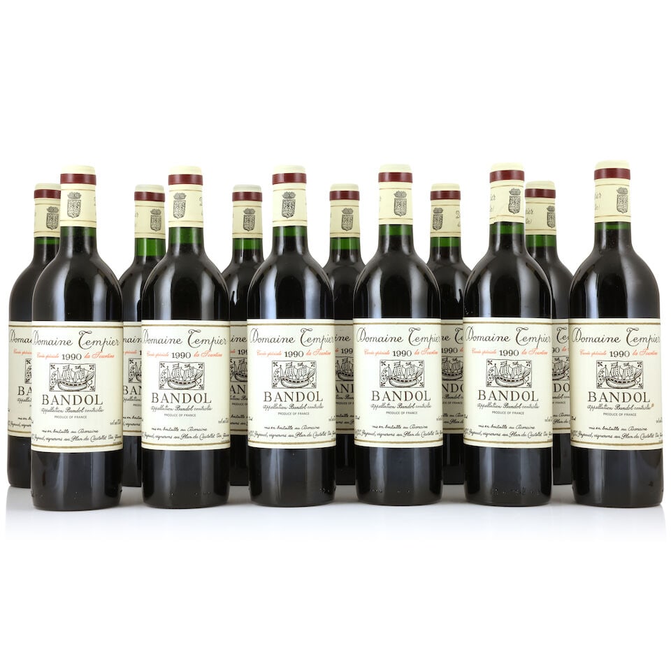 Domaine Tempier Bandol Cuvée Spéciale La Tourtine, 1990 (12 x 750ml): Domaine Tempier Bandol Cuvée Spéciale La Tourtine, 1990 (12 x 750ml) Region: Bandol Capsule: 1 slightly worn Label: 1 slightly stained Packaging: original carton (damp-affected & worn) For f