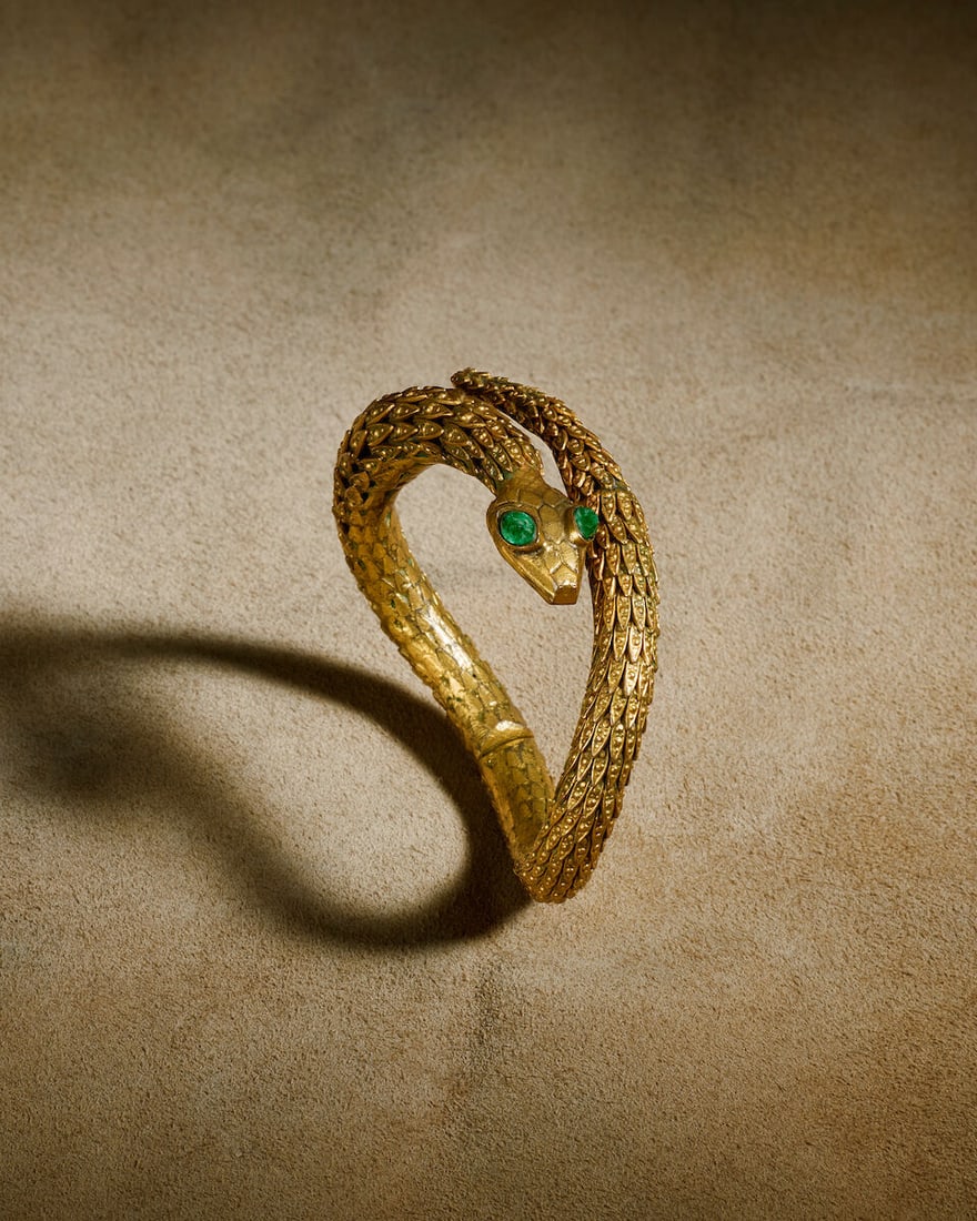 Robert Goossens for Chanel: a Filigree Snake Bangle Haute Couture, 1960s (includes modern Chanel...: Robert Goossens for Chanel: a Filigree Snake Bangle Haute Couture, 1960s Gilt hinged snake bracelet with graduated filigree caps, green glass eyes Condition Grade B Inner circumference 5.5cm, opening 