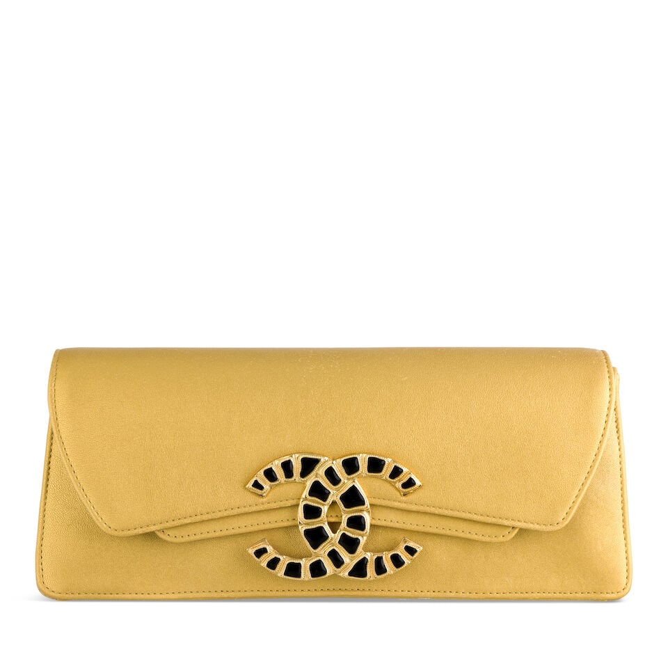 Chanel: a Gold Calfskin Jumbo Clutch Paris-New York Métiers d'Art Collection, Pre-Fall 2019...: Chanel: a Gold Calfskin Jumbo Clutch Paris-New York Métiers d'Art Collection, Pre-Fall 2019, Runway Look 9 Creative Director: Karl Lagerfeld Gold hardware with black crocodile style enamelled CC 