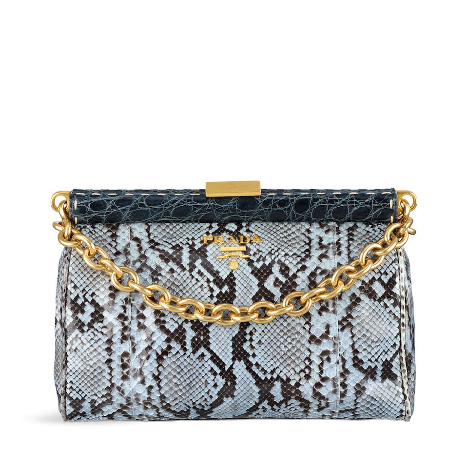 Prada: a Periwinkle Blue Python and Crocodile Bag c.2011 (includes authenticity card and booklet): Prada: a Periwinkle Blue Python and Crocodile Bag c.2011 Creative Director: Miuccia Prada Light blue python skin soft bag with dark blue crocodile trim frame closure, gold tone hardware and removable 