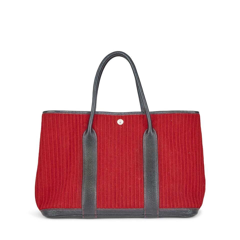 Hermès: a Red Ribbed Wool and Black Negonda Leather Garden Party 36 2006: Hermès: a Red Ribbed Wool and Black Negonda Leather Garden Party 36 2006 Palladium hardware Condition Grade B 36cm wide, 26cm high, 16cm deep, 15cm handle drop For further information on this lot