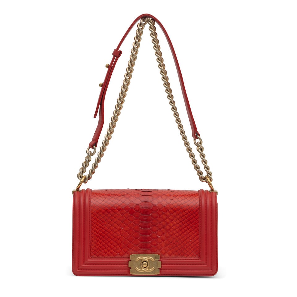 Chanel: a Red Python Medium Boy Bag 2014 (includes serial sticker, authenticity card, dust bag a...: Chanel: a Red Python Medium Boy Bag 2014 Creative Director: Karl Lagerfeld Antiqued gold tone hardware Condition Grade B+ 25cm wide, 20cm high, 50cm shoulder drop, includes serial sticker, authenticit