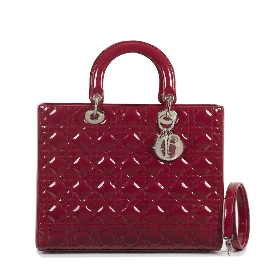 Christian Dior: a Red Patent Leather Large Lady Dior 2011 (includes shoulder strap and dust bag): Christian Dior: a Red Patent Leather Large Lady Dior 2011 Cannage quilted patent leather with silver hardware Condition Grade A- 32cm wide, 25cm high, 12cm deep, 10cm handle drop, 35cm shoulder drop, 