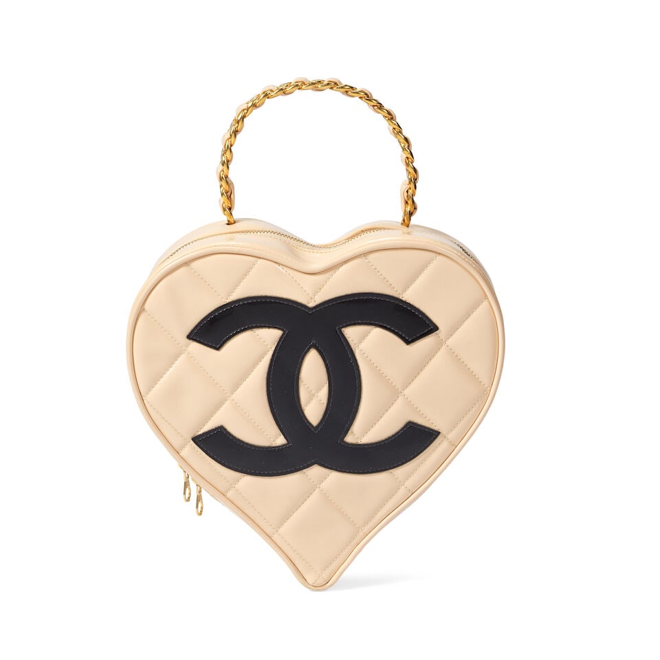 Chanel: a Beige Patent Leather Heart Vanity Bag 'Barbie' Collection, Spring 1995 (includes seria...: Chanel: a Beige Patent Leather Heart Vanity Bag 'Barbie' Collection, Spring 1995 Creative Director: Karl Lagerfeld Beige patent leather with black CC, gold tone hardware Condition Grade B- 23cm wide, 