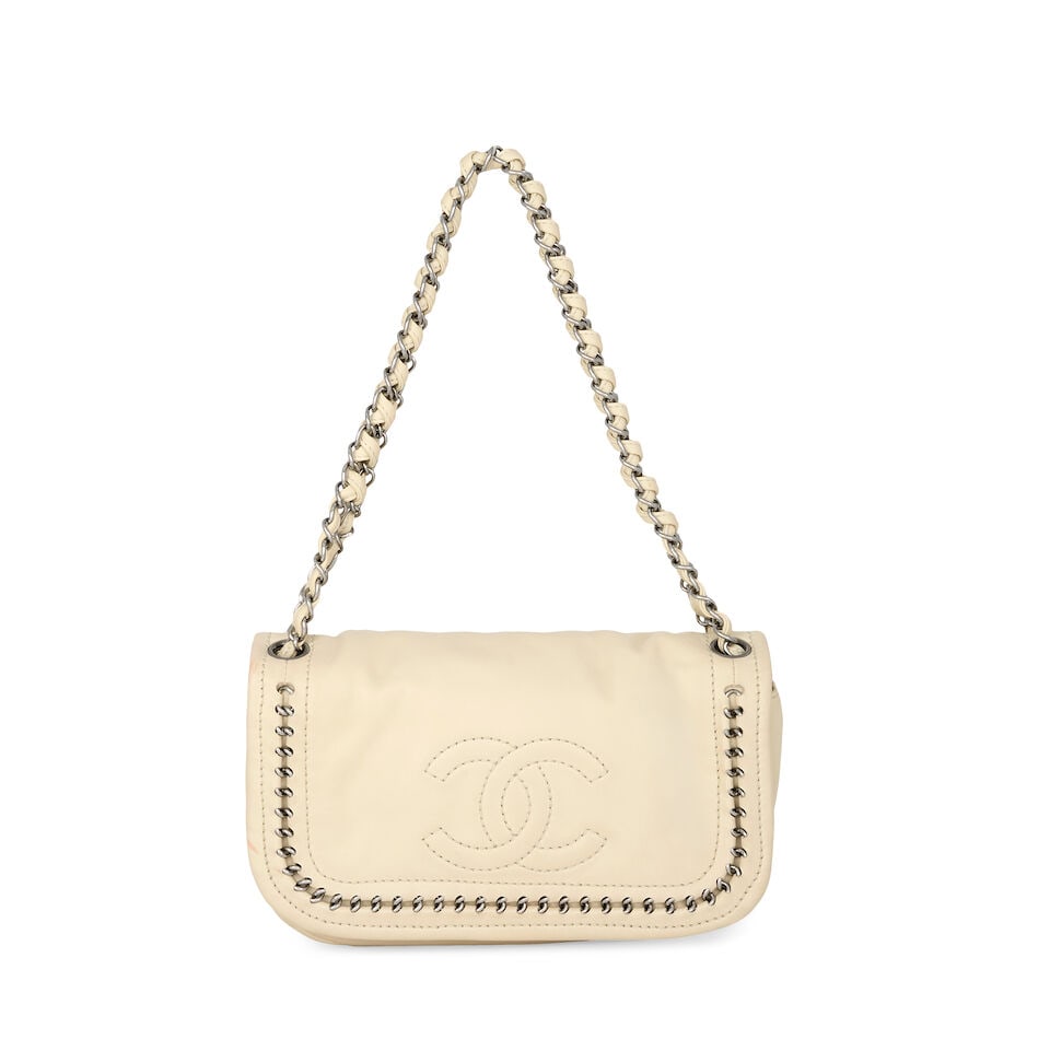 Chanel: a Cream Luxe Ligne Accordion Flap Bag 2005-06 (includes serial sticker and box): Chanel: a Cream Luxe Ligne Accordion Flap Bag 2005-06 Creative Director: Karl Lagerfeld Smooth calfskin with stitched CC detail and silver chain design, beige leather lining Condition Grade C+ 25cm wi