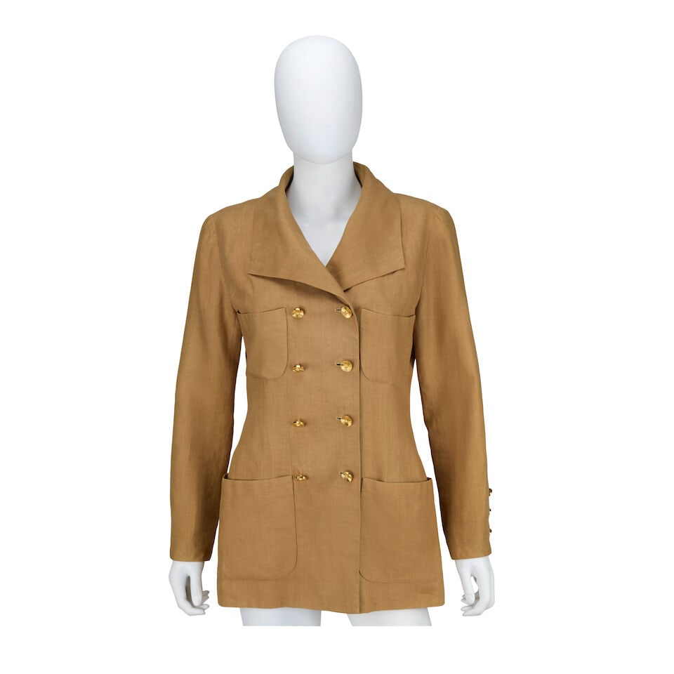 Chanel: a Taupe Linen Blazer Spring 1990: Chanel: a Taupe Linen Blazer Spring 1990 Creative Director: Karl Lagerfeld Double breasted with gilt metal buttons, four patch pockets, and wide flat lapels Condition Grade B- Labelled size 40 For fur