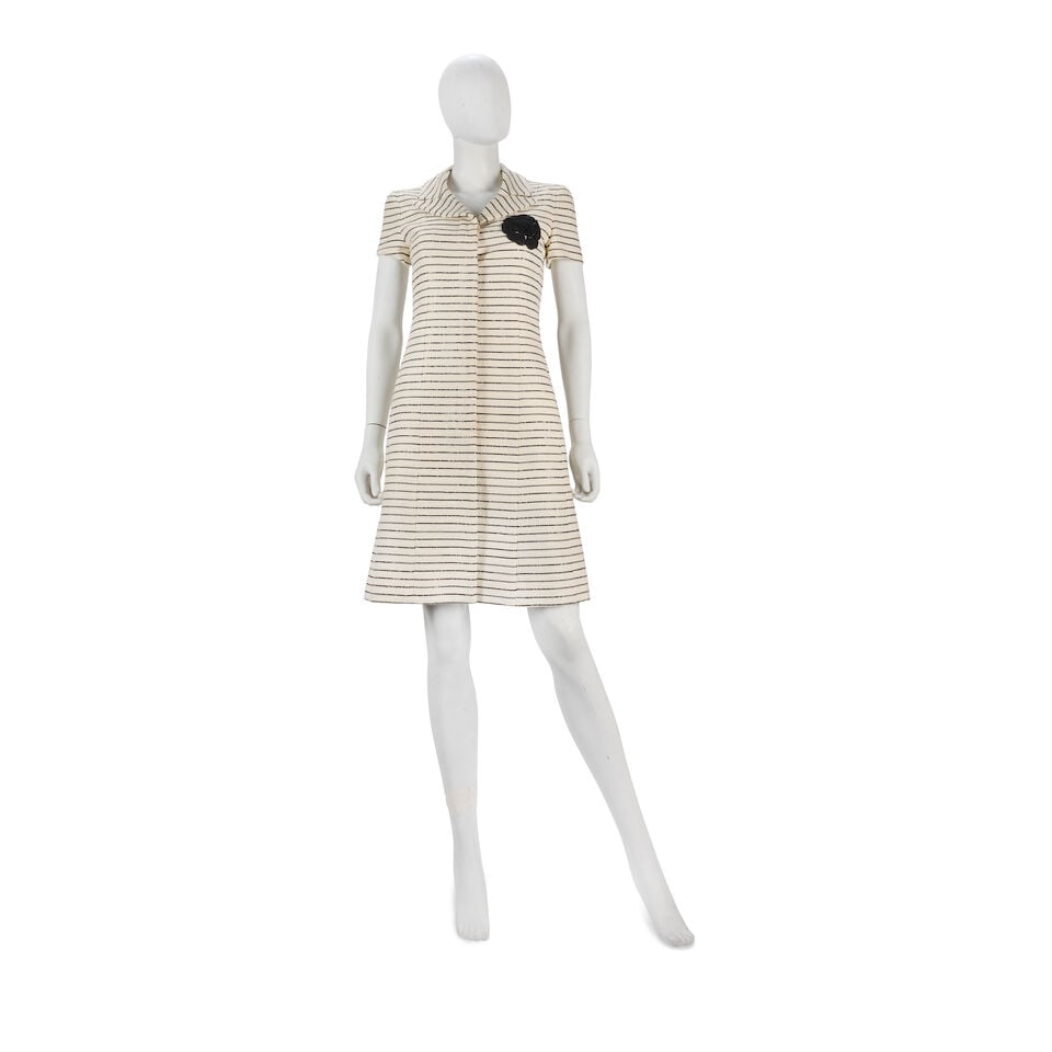 Chanel: a Cream and Black Dress Jacket and Slip Cruise 2001: Chanel: a Cream and Black Dress Jacket and Slip Cruise 2001 Creative Director: Karl Lagerfeld Cream cotton blend tweed with bands of small black sequins, rubberised Camellia detail to chest, button fa