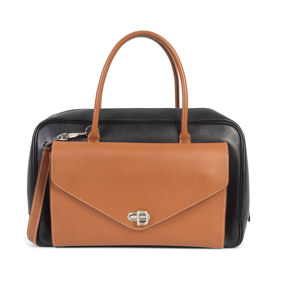 Hermès: a Black and Gold Swift Leather Bi-Colour Lorraine Bag 2005 (includes shoulder strap...: Hermès: a Black and Gold Swift Leather Bi-Colour Lorraine Bag 2005 Black leather body with Gold front pocket featuring card slots, pockets and pen holder, larger zipped compartment with patch poc