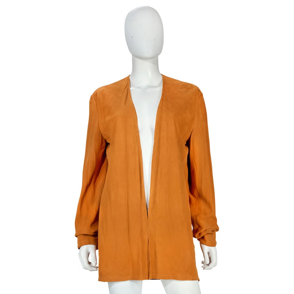 Hermès: a Burnt Orange Suede Jacket Autumn 2000 (includes garment bag): Hermès: a Burnt Orange Suede Jacket Autumn 2000 Creative Director: Martin Margiela Unstructured doeskin leather with open front, demi lined in silk Condition Grade A- Labelled size 42, includes g