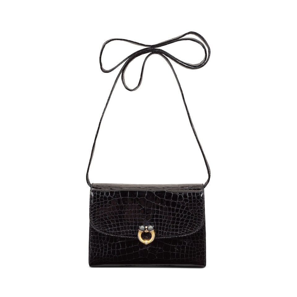 Gucci: a Shiny Black Baby Crocodile Handbag 1980/90s: Gucci: a Shiny Black Baby Crocodile Handbag 1980/90s Shiny black crocodile skin with two-tone metal horseshoe clasp, detachable shoulder strap Condition Grade B- 18cm wide, 13cm high, 6cm deep, 60cm s