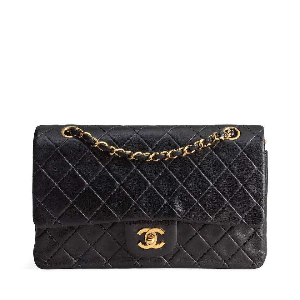 Chanel: a Black Lambskin Classic Medium Double Flap Bag 1991-94 (includes serial sticker, authen...: Chanel: a Black Lambskin Classic Medium Double Flap Bag 1991-94 Creative Director: Karl Lagerfeld Gold tone hardware Condition Grade B 25cm wide, 15cm high, 7cm deep, 24/43cm shoulder drop, includes s