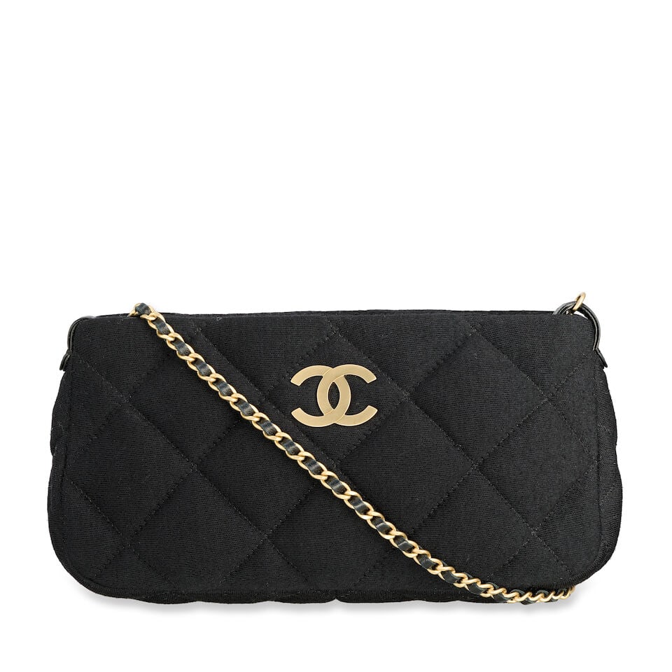 Chanel: a Black Quilted Jersey Pochette 2006-08 (includes serial sticker and authenticity card): Chanel: a Black Quilted Jersey Pochette 2006-08 Creative Director: Karl Lagerfeld Black jersey exterior with leather lining, matte gold tone hardware and chain shoulder strap Condition Grade B+ 25cm w