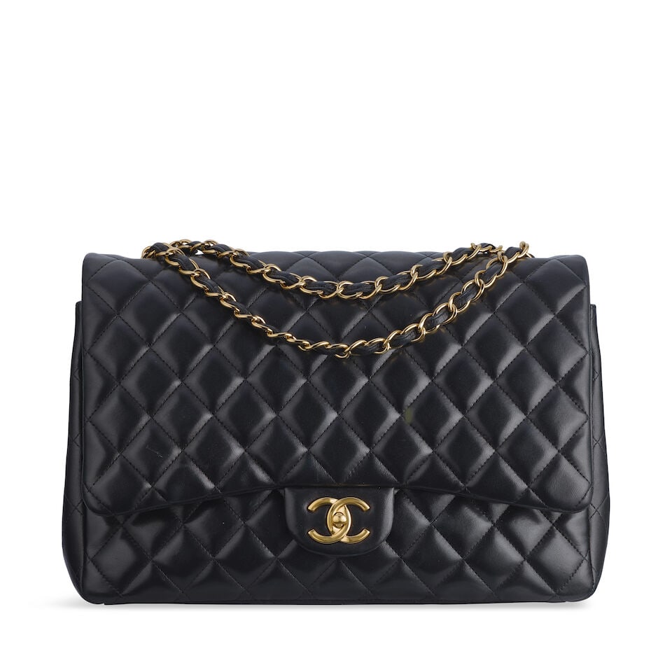 Chanel: a Black Lambskin Leather Maxi Double Flap Bag 2010-11 (includes serial sticker, authenti...: Chanel: a Black Lambskin Leather Maxi Double Flap Bag 2010-11 Creative Director: Karl Lagerfeld Quilted black lambskin with gold tone hardware Condition Grade B 33cm wide, 22cm high, 9.5cm deep, 28/51