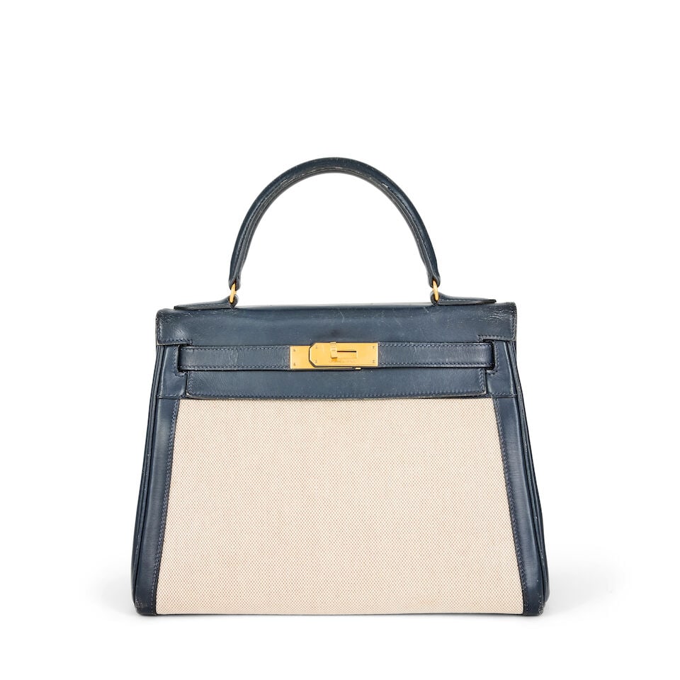 Hermès: a Navy Box Leather and Toile Retourne Kelly 28 1985 (missing padlock, keys and cloc... (1 of 2)