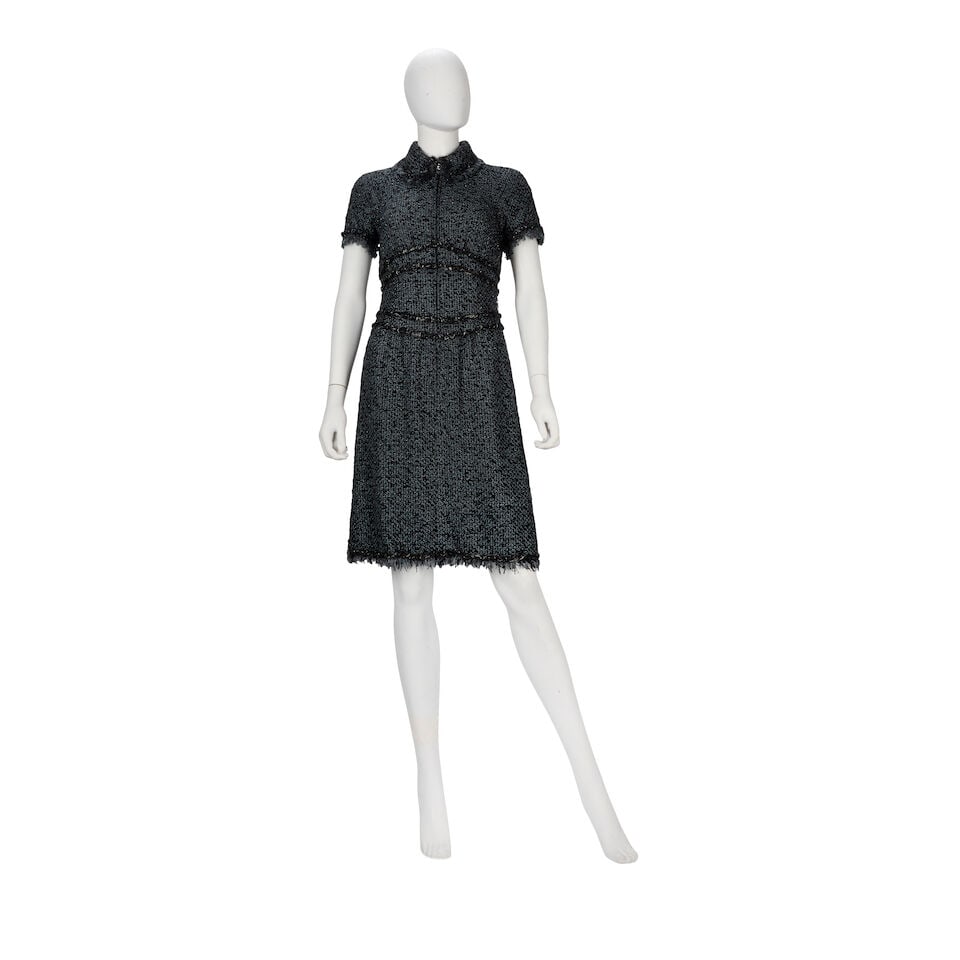 Chanel: a Blue and Black Tweed Dress Autumn 2006: Chanel: a Blue and Black Tweed Dress Autumn 2006 Creative Director: Karl Lagerfeld Zip-down, capped-sleeve dress with raw edge collar and cuffs, and ribbon and chain details Condition Grade B- Labelle