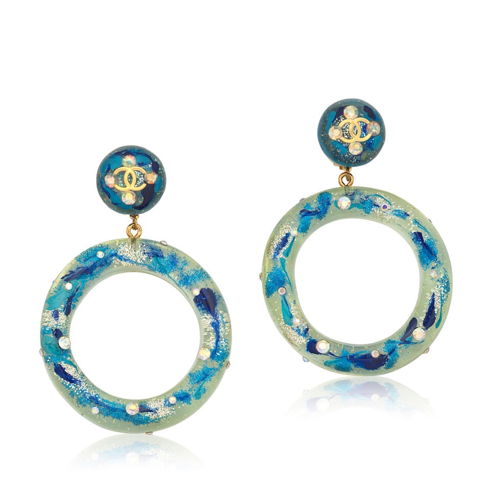 Victoire de Castellane for Chanel: a Pair of Resin and Blue Glitter Hoop Earrings Collection 28,...: Victoire de Castellane for Chanel: a Pair of Resin and Blue Glitter Hoop Earrings Collection 28, Spring 1992 Creative Director: Karl Lagerfeld Clear resin with shades of blue and silver glitter inclus
