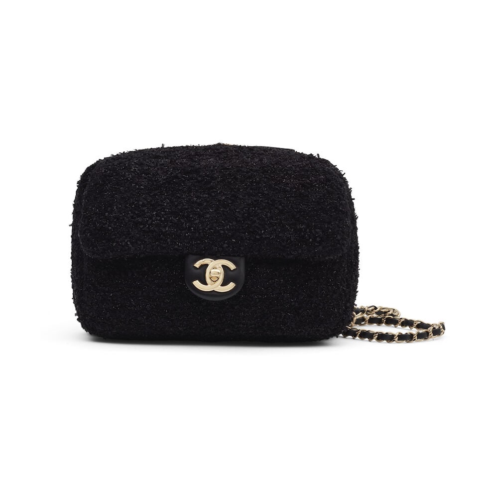 Chanel: a Black Shimmery Tweed Coco Beach Convertible Tote (includes microchip and dust bag): Chanel: a Black Shimmery Tweed Coco Beach Convertible Tote Creative Director: Virginie Viard CC crossbody bag with removable shoulder strap, a wrap-around zipper compartment which opens to expand the 