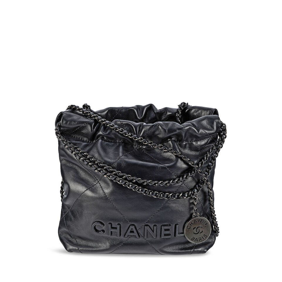 Chanel: a So Black Leather Mini 22 Bag (includes microchip, dust bag, copy of receipt and box): Chanel: a So Black Leather Mini 22 Bag Creative Director: Virginie Viard Quilted calfskin with black hardware Condition Grade A- 22cm wide, 21cm high, 8cm deep, 10cm handle drop, 55cm shoulder drop, i