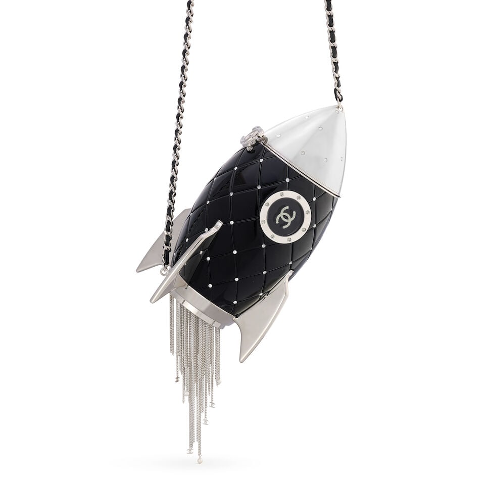 Chanel: a Black Plexiglass Rocket Ship Minaudière Autumn 2017, Runway look 93 (includes dus...: Chanel: a Black Plexiglass Rocket Ship Minaudière Autumn 2017, Runway look 93 Creative Director: Karl Lagerfeld Realistically modelled black Plexiglass rocket ship bag with silver tone hardware a