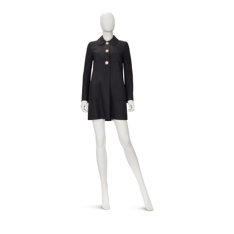 Miu Miu: a Black Coat with Jewel Buttons: Miu Miu: a Black Coat with Jewel Buttons Creative Director: Miuccia Prada Black viscose with crystal and simulated pearl button fastening Condition Grade A- Labelled size IT 40 (French 36) For further