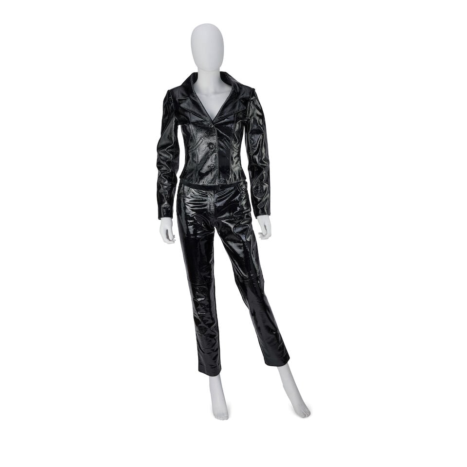 Chanel: a Black Patent Leather Jacket and Trouser Ensemble Autumn 2001: Chanel: a Black Patent Leather Jacket and Trouser Ensemble Autumn 2001 Creative Director: Karl Lagerfeld Black patent lambskin, the trousers with black suede back panels and waistband (2) Condition Gr