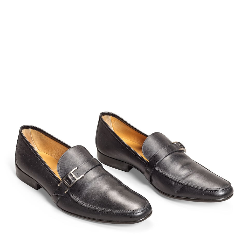 Hermès: a Pair of Men's Giovanni Loafers (includes box): Hermès: a Pair of Men's Giovanni Loafers Smooth black leather with brushed Palladium detail Condition Grade B Size 44, includes box Lot to be sold without reserve. For further information on this