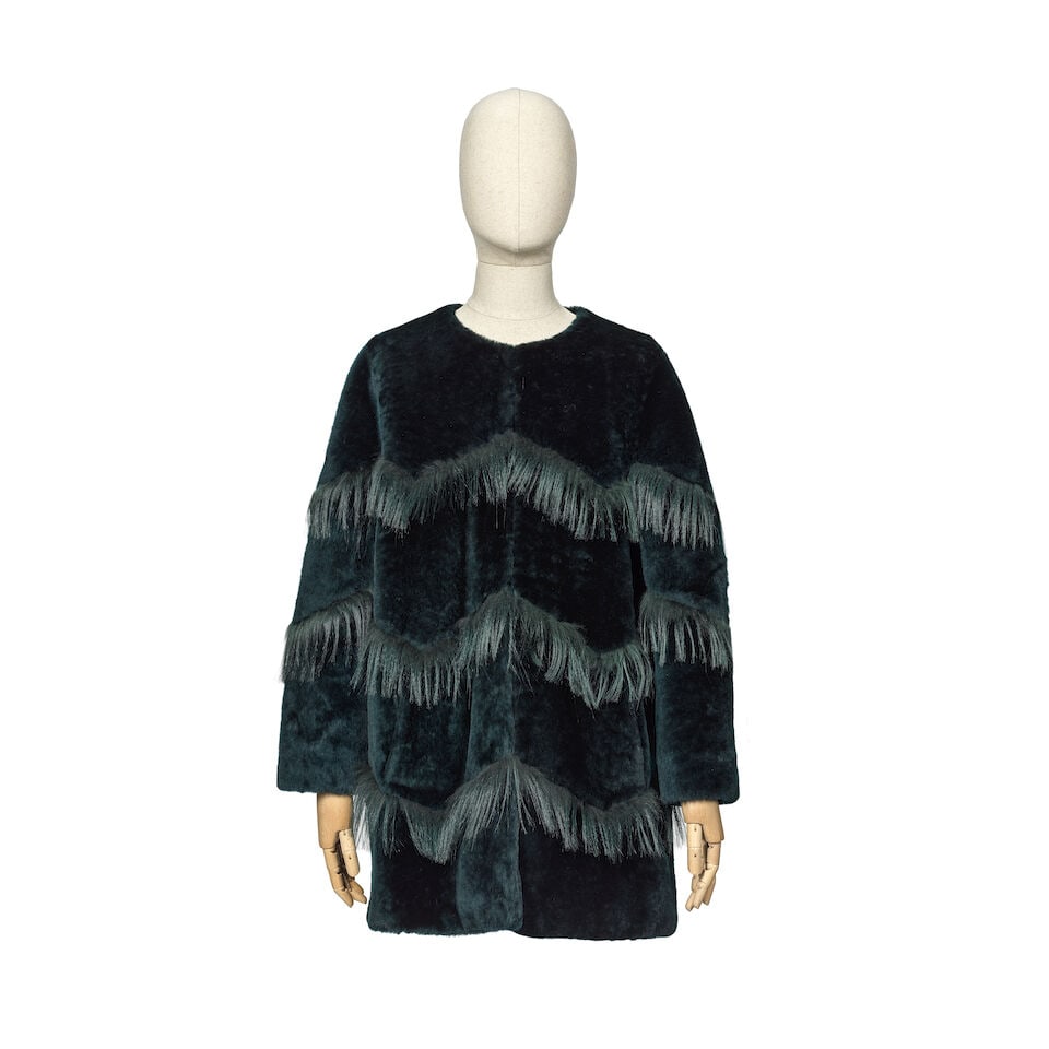 Uterqüe: a Teal Green Shearling Coat: Uterqüe: a Teal Green Shearling Coat Dark green lamb's shearling with goat fur zig-zag trim Condition Grade A Labelled size S Lot to be sold without reserve. For further information on this lot p