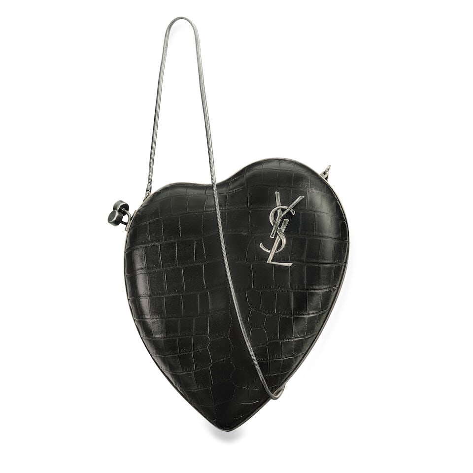 Yves Saint Laurent: a Black Embossed Crocodile 'Love Box' Clutch Bag (includes dust bag): Yves Saint Laurent: a Black Embossed Crocodile 'Love Box' Clutch Bag Heart-shaped clutch bag with snake chain shoulder strap, in embossed leather and gunmetal hardware Condition Grade A- 17cm wide, 19