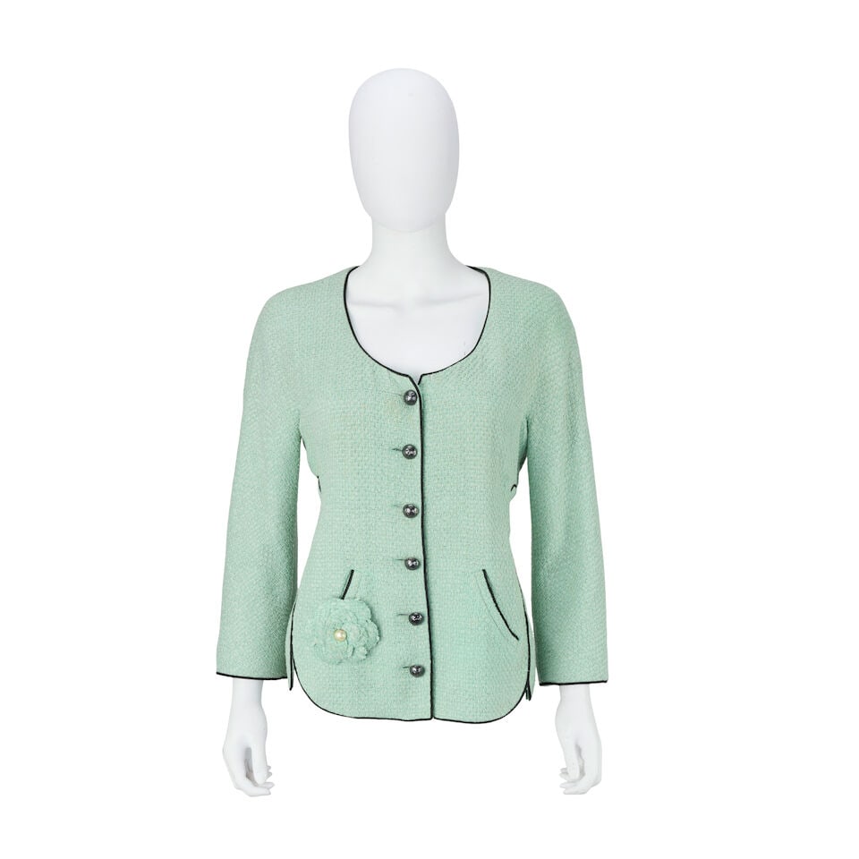 Chanel: a Mint Green and Black Trim Jacket Spring 2012, Runway Look 20: Chanel: a Mint Green and Black Trim Jacket Spring 2012, Runway Look 20 Creative Director: Karl Lagerfeld Green cotton blend tweed with black piping edging and hammered gunmetal round buttons, together