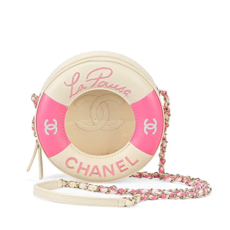 Chanel: a Pink and White Lambskin Lifebuoy Bag 'La Pausa' Collection, Cruise 2019 (includes seri...: Chanel: a Pink and White Lambskin Lifebuoy Bag 'La Pausa' Collection, Cruise 2019 Creative Director: Karl Lagerfeld Round pink and white leather bag realistically modelled as a lifebuoy/life saver wit