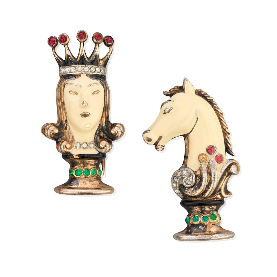 Trifari: Two Sterling Silver Enamelled Chess Fur Pins c.1945: Trifari: Two Sterling Silver Enamelled Chess Fur Pins c.1945 To include the Queen, inscribed patent no 140,843, and the Horse, inscribed patent no 140,855, (2) Condition Grade B-/D 2cm wide, 4cm high 