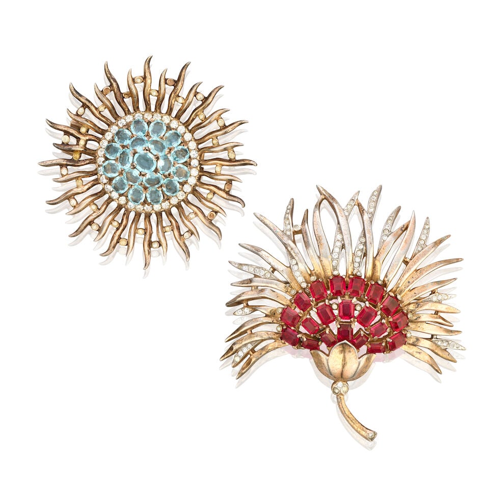 Trifari: Two Chrysanthemum Flower Sterling Silver Pin Brooches 1940s: Trifari: Two Chrysanthemum Flower Sterling Silver Pin Brooches 1940s To include a sterling fan chrysanthemum flower pin brooch with red emerald-cut rhinestones, c.1944, 7cm wide, 7.5cm high, and a ste
