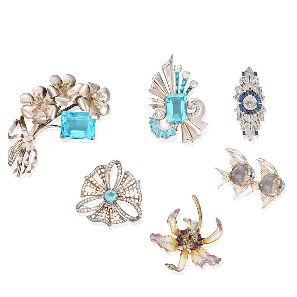 A Collection of Costume Jewellery by Coro and Mazer 1930s and 40s: A Collection of Costume Jewellery by Coro and Mazer 1930s and 40s Coro pieces to include: a silver gilt Jelly Belly fish convertible brooch/fur pin stamped 'Sterling', an enamel orchid brooch, an Art 