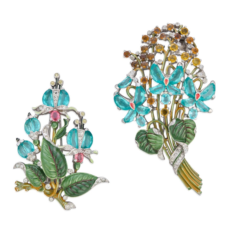 Trifari: Two Demi-Lune Crystal Flower Pin Brooches Late 1930s-early 1940s: Trifari: Two Demi-Lune Crystal Flower Pin Brooches Late 1930s-early 1940s To include a painted demi-lune crystal fuchsia flower fur pin, c.1942, inscribed 'Pat Pend', 5.5cm wide, 8cm high, and a paint