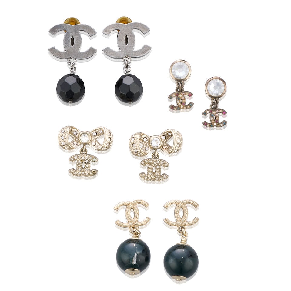Chanel: Four Pairs of Drop Earrings 2010s: Chanel: Four Pairs of Drop Earrings 2010s Creative Director: Karl Lagerfeld To include a pair of bow and CC earrings, 2016; a pair of CC earrings with multicoloured crystals, Autumn 2011; a pair of ch