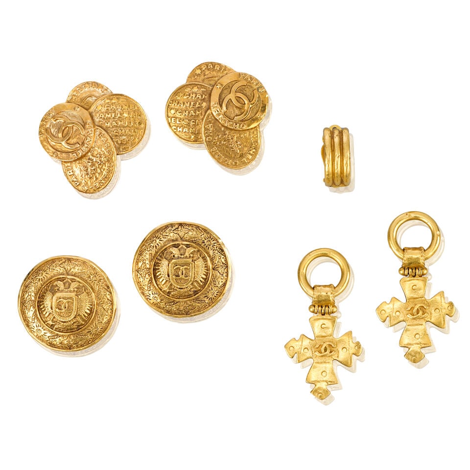 Chanel: Three Pairs of Gilt Clip Earrings 1990s: Chanel: Three Pairs of Gilt Clip Earrings 1990s Creative Director: Karl Lagerfeld/Victoire de Castellane To include a pair of round shield earrings with eagle head motif, 3.5cm diameter, a pair of coi