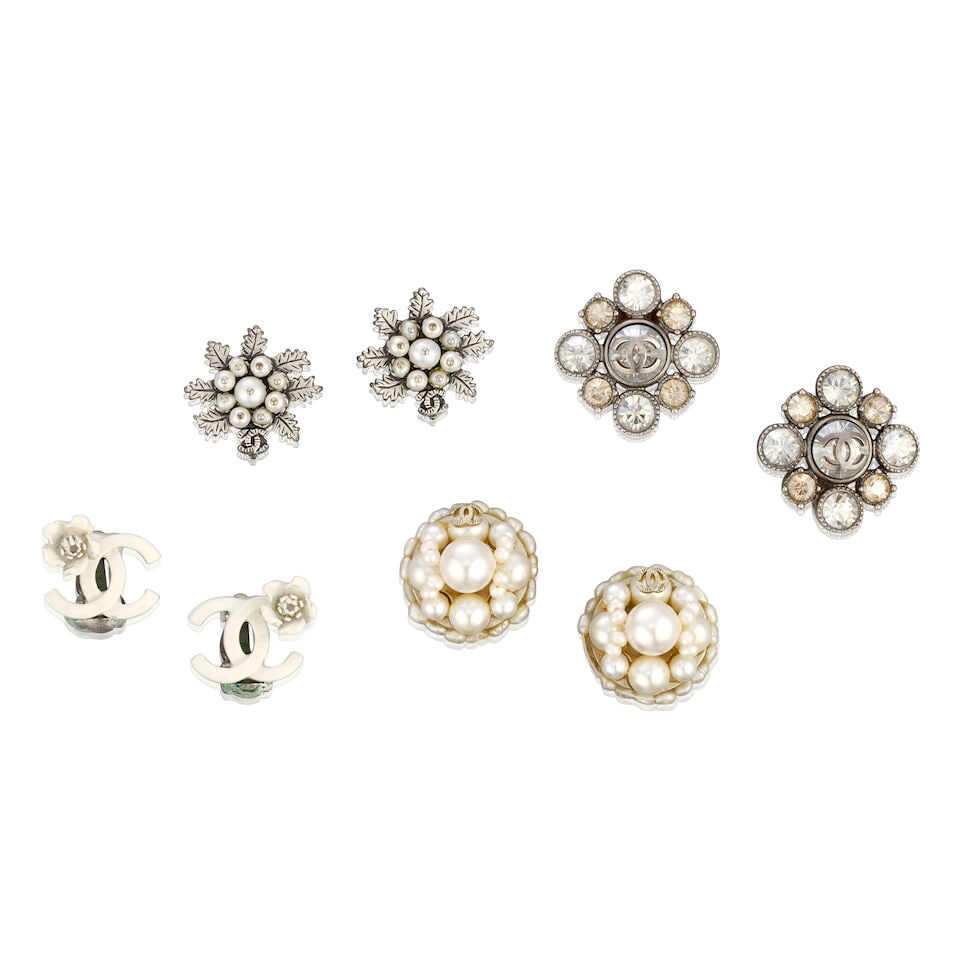 Chanel: Four Pairs of Stud Earrings: Chanel: Four Pairs of Stud Earrings Creative Director: Karl Lagerfeld To include a pair of white enamelled CC ear clips with camellia detail, Spring 2004, a pair of crystal embellished CC ear clips, C